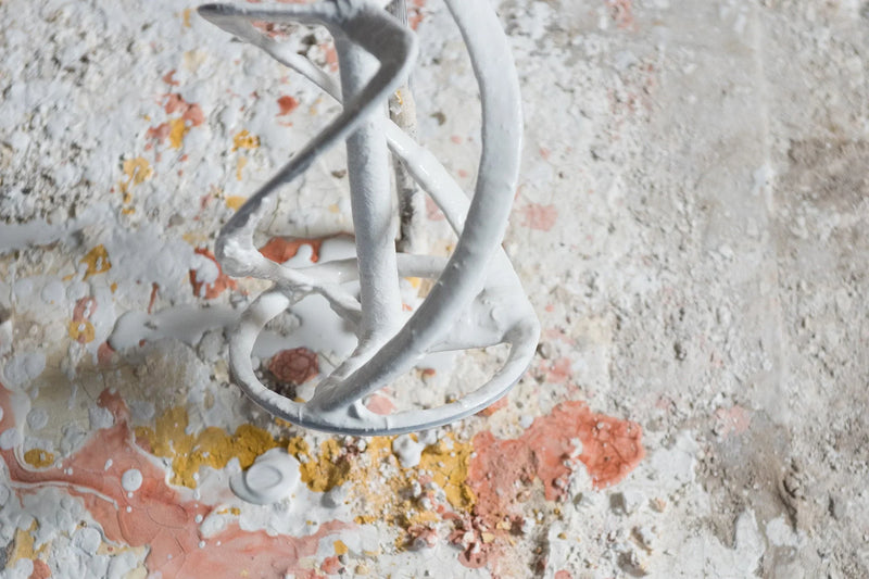 Traditional decorating tool resting on a painted decorative surface