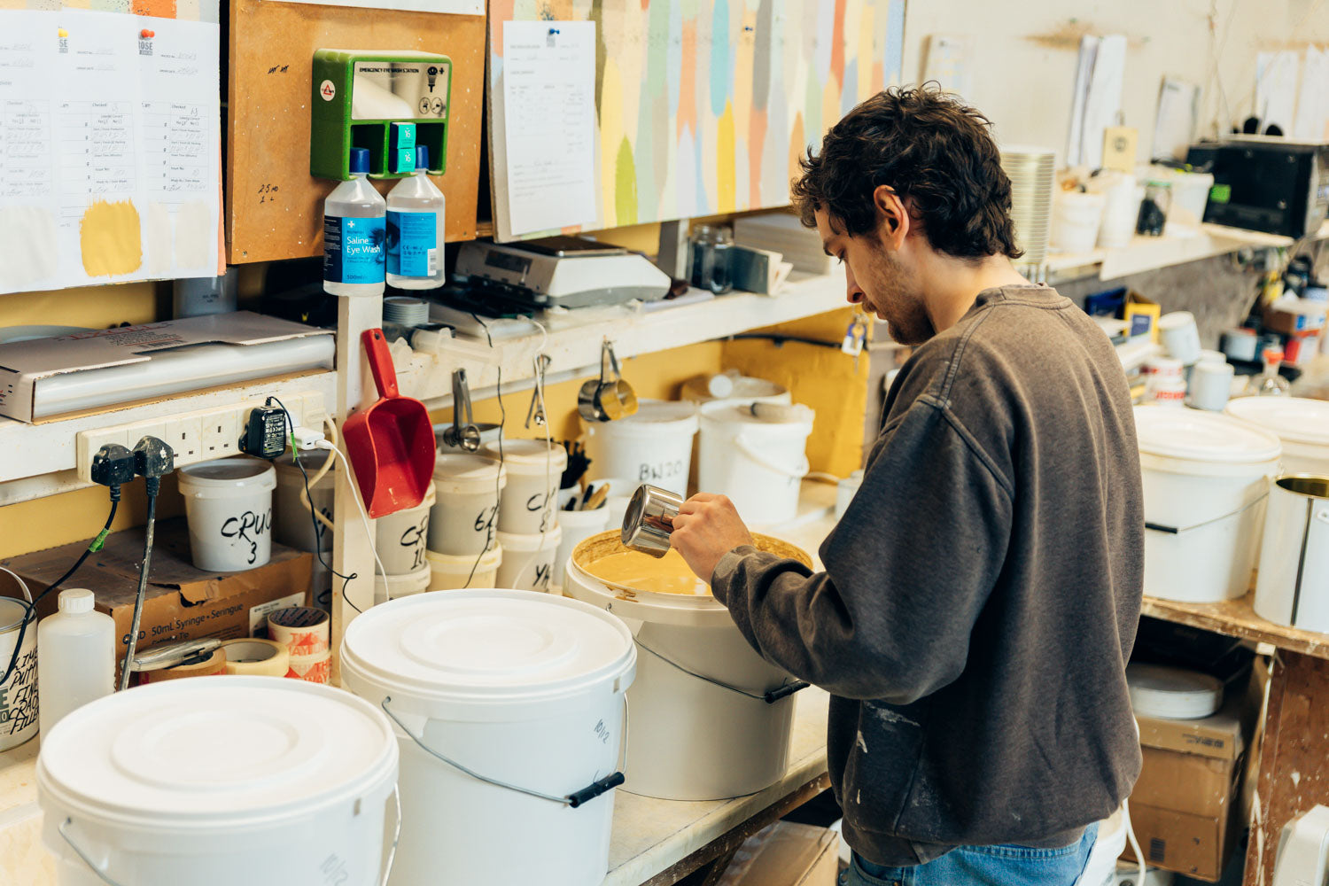 Person working in studio mixing paints